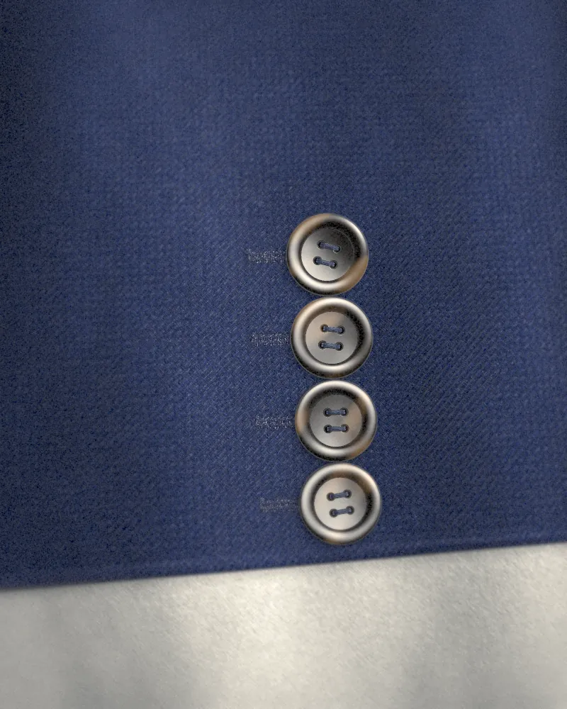 Four horn buttons on a navy sleeve above a white shirt cuff