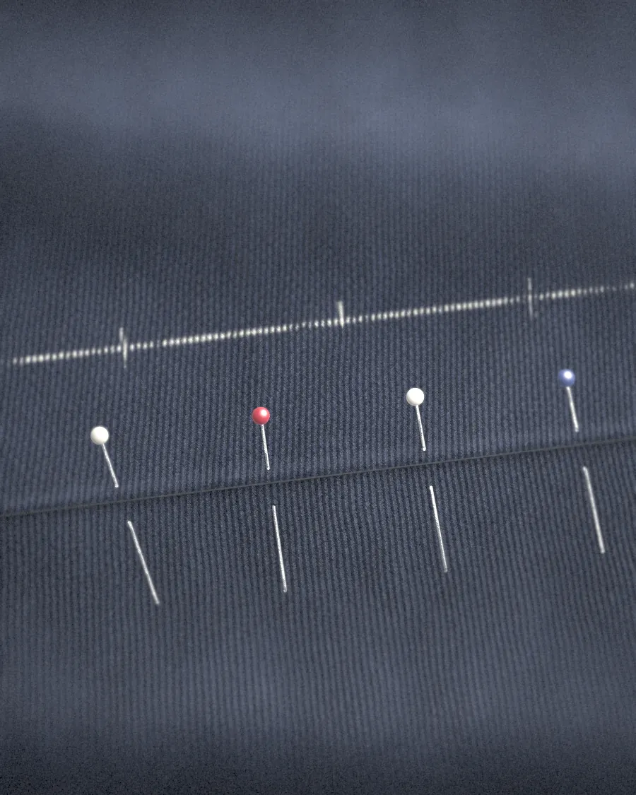 A hem turned up, chalked and pinned